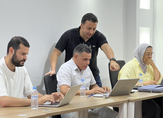 An AI Crafters instructor supporting participants during a hands-on workshop